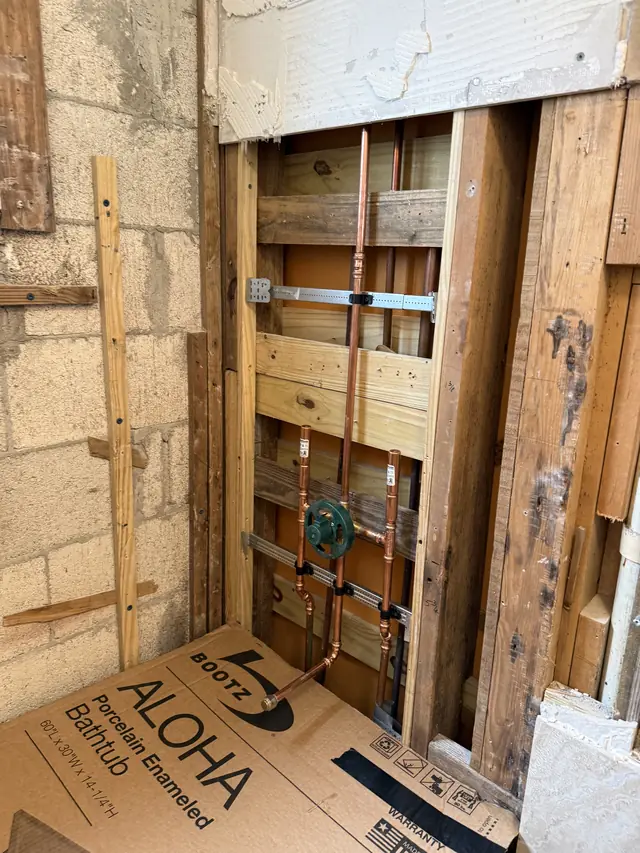 Copper tub and shower valve rough-in inside an open wall