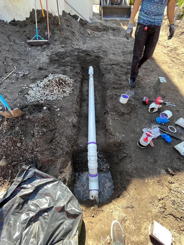 New sewer piping positioned in a residential repair trench